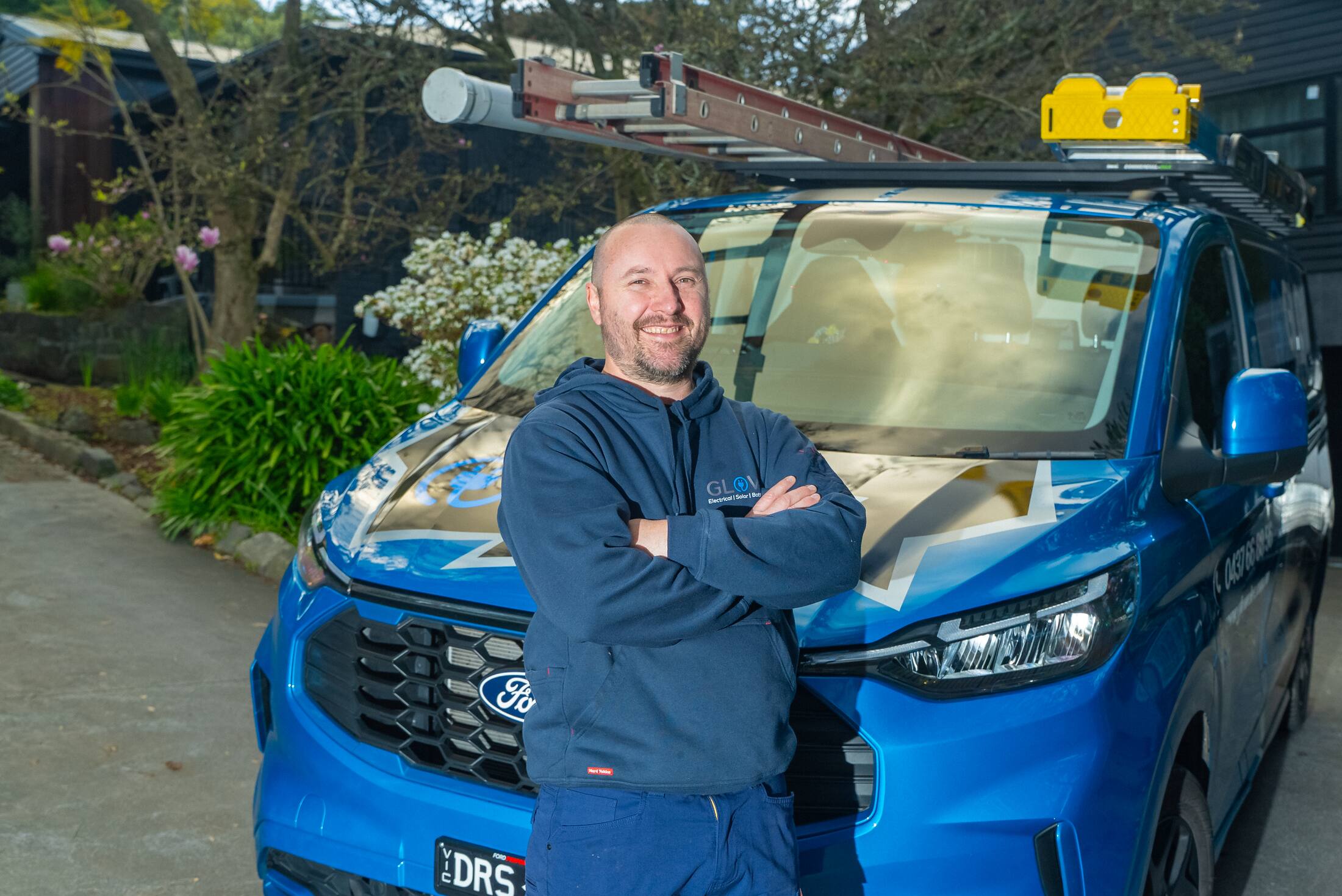 Michael from Glow Electrical beside his van