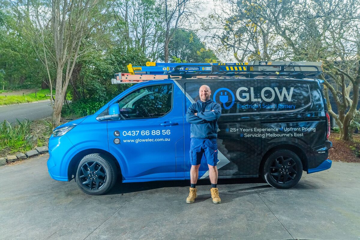 The Glow Electrical van in side profile with the full wrap